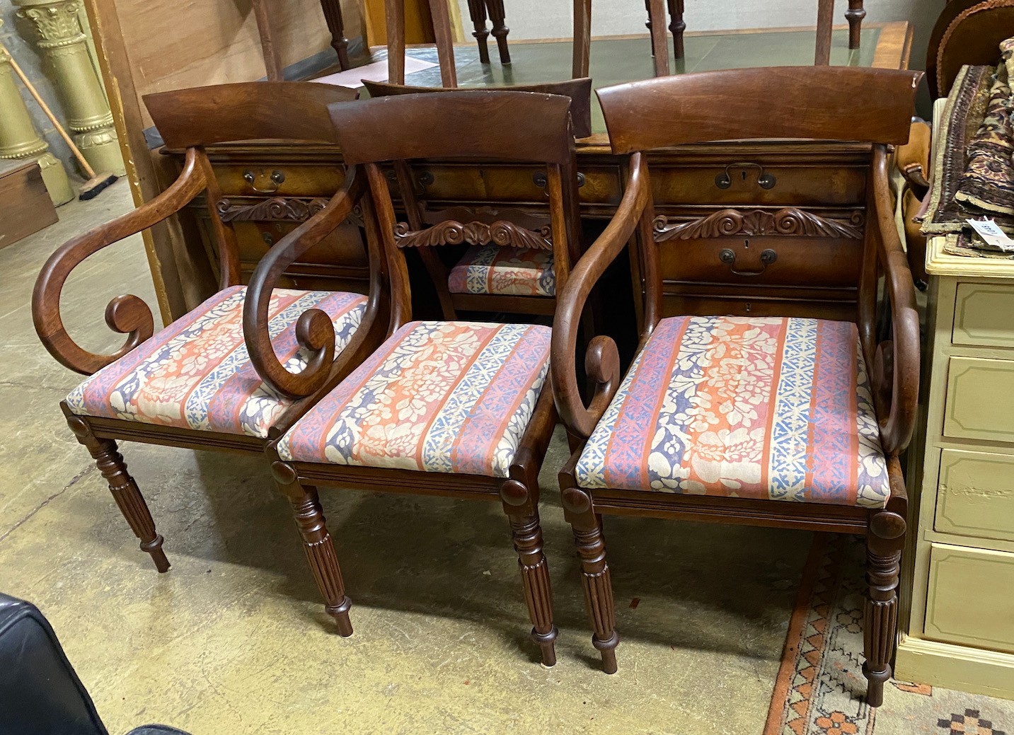A set of seven Regency mahogany dining chairs, two with arms